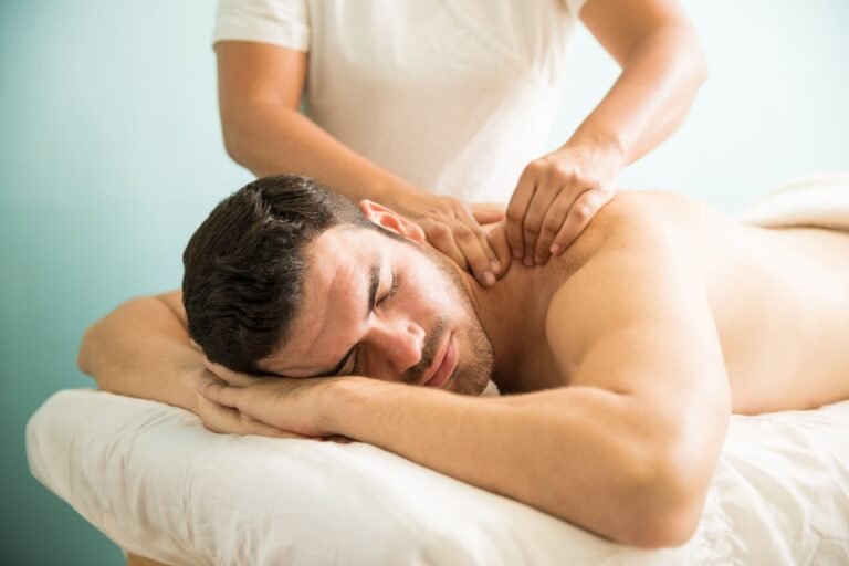 very relaxed young latin man getting deep tissue massage his back wellness spa clinic compressed 1 768x512